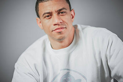 man in white tshirt looking at camera